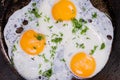 Top view of three fried eggs in the frying pan Royalty Free Stock Photo