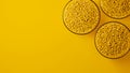 Top view on three glass cups with yellow plastic polypropylene granules, masterbatch polymer grain, on yellow backdrop Royalty Free Stock Photo