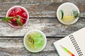 Top view of three glasses with cool lemonade on table near notebook Royalty Free Stock Photo