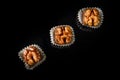 top view on three healthy useful organic handmade candies with walnut