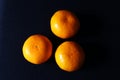 Top view of Three orange mandarin fruits