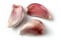 Top view on three purple garlic cloves isolated with shadows o Royalty Free Stock Photo