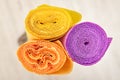Three rolls of multi-colored crinkled paper for creativity and c