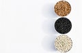 Top view of three varieties of beans in bowls, white background Royalty Free Stock Photo