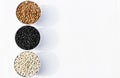 Top view of three varieties of beans in bowls, white background Royalty Free Stock Photo