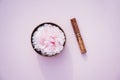 Top view Tibetan singing bowl with floating in water pink peony inside and special stick on pink background. Meditation Royalty Free Stock Photo