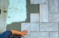 Top view of a tiler working in a garden