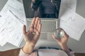 Top view. Tired business woman holding a headache pill on the workplace with glass of water on the background of graphics and cha