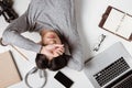 Top view of tired businessman at workplace with copy space