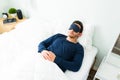 Top view of a tired man sleeping with a mask Royalty Free Stock Photo