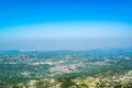 Cetinje city top landscape from viewpoint  Njegos mausoleum. Lovcen National Park. Montenegro. Summer blue montanian view Royalty Free Stock Photo