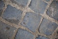 top view to grey square cobblestone pavement. Diagonal geometric composition. Street surface. Wallpaper and background