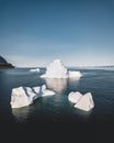 Top view to iceberg in Greenland breaking of Glacier. Top and underwater parts of Iceberg. Aerial Drone view. Ilulissat