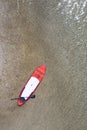 Top view to Stand-Up-Paddling board at gravel sand shore