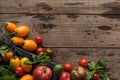 Top view of tomatoes and spinach in box on wooden table. Royalty Free Stock Photo