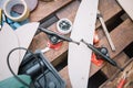 Top view of tools and screws on table with skateboard deck and trucks Royalty Free Stock Photo