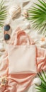 Top view of tote bag on sandy beach with seashells and sunglasses for summer design Royalty Free Stock Photo