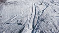 Top view of tourist walking in snowy mountains. Clip. Climber walks along snowy slopes of massive mountain on sunny day