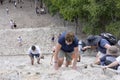 Top view of tourists climb the Pyramid Nohoch Mul along the guiding rope at the Mayan Coba Ruins, Mexico