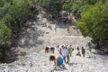 Top view of tourists climb the Pyramid Nohoch Mul along the guiding rope at the Mayan Coba Ruins, Mexico Royalty Free Stock Photo