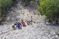 Top view of tourists climb the Pyramid Nohoch Mul along the guiding rope at the Mayan Coba Ruins, Mexico Royalty Free Stock Photo