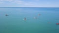 Top view of tourists on sea with SUP-boards. Clip. Beautiful clear sea with people floating on boards engaged in sup