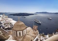 Top view of town Fira with the church of saint john in on the island of Santorini and cruise ships in the waters of the volcanic C Royalty Free Stock Photo