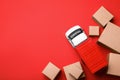 Top view of toy truck with boxes on background. Logistics and wholesale concept Royalty Free Stock Photo