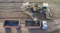 Top view of the tractor and truck in the field of sugar beet. Aerial view Royalty Free Stock Photo