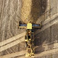 Top view of the tractor and freight car in the field of sugar beet. Aerial view