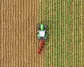 Top view on a tractor with a plow among the field, potato seeding process, tractor divides the field on different parts, 3d