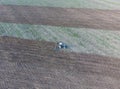 Top view of the tractor that plows the field. disking the soil. Soil cultivation after harvest Royalty Free Stock Photo