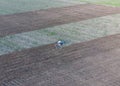 Top view of the tractor that plows the field. disking the soil. Soil cultivation after harvest Royalty Free Stock Photo