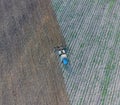 Top view of the tractor that plows the field. disking the soil. Soil cultivation after harvest Royalty Free Stock Photo