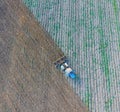 Top view of the tractor that plows the field. disking the soil. Soil cultivation after harvest Royalty Free Stock Photo