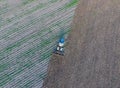 Top view of the tractor that plows the field. disking the soil. Soil cultivation after harvest Royalty Free Stock Photo