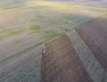 Top view of the tractor that plows the field. disking the soil. Soil cultivation after harvest Royalty Free Stock Photo