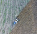 Top view of the tractor that plows the field. disking the soil. Royalty Free Stock Photo