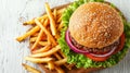 Top view of traditional burger and french fries on wooden table with space for text Royalty Free Stock Photo