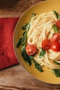 Top view of traditional Italian pasta with tomatoes and arugula Royalty Free Stock Photo
