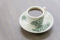 Top view traditional Singapore kopitiam or kopi milk coffee mug with saucer