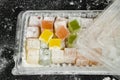 Traditional Turkish Delight in cardboard box,on black, Royalty Free Stock Photo