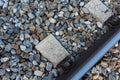 Top view of train tracks surrounded by rocks at daytime Royalty Free Stock Photo