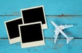 Top view of travel instant photographs next to airplane Royalty Free Stock Photo