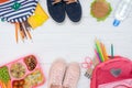 top view of tray with kids lunch, school bags and shoes Royalty Free Stock Photo