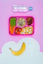top view of tray with kids lunch for school, bottle of water and banana Royalty Free Stock Photo