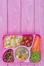 top view of tray with kids lunch for school on violet Royalty Free Stock Photo