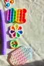 Top view of trend colorful push pop it bubble sensory fidget toys of different shapes