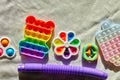 Top view of trend colorful push pop it bubble sensory fidget toys of different shapes
