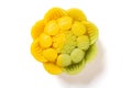 trendy and beautiful flower shape yellow and green colors moon cake on a white background